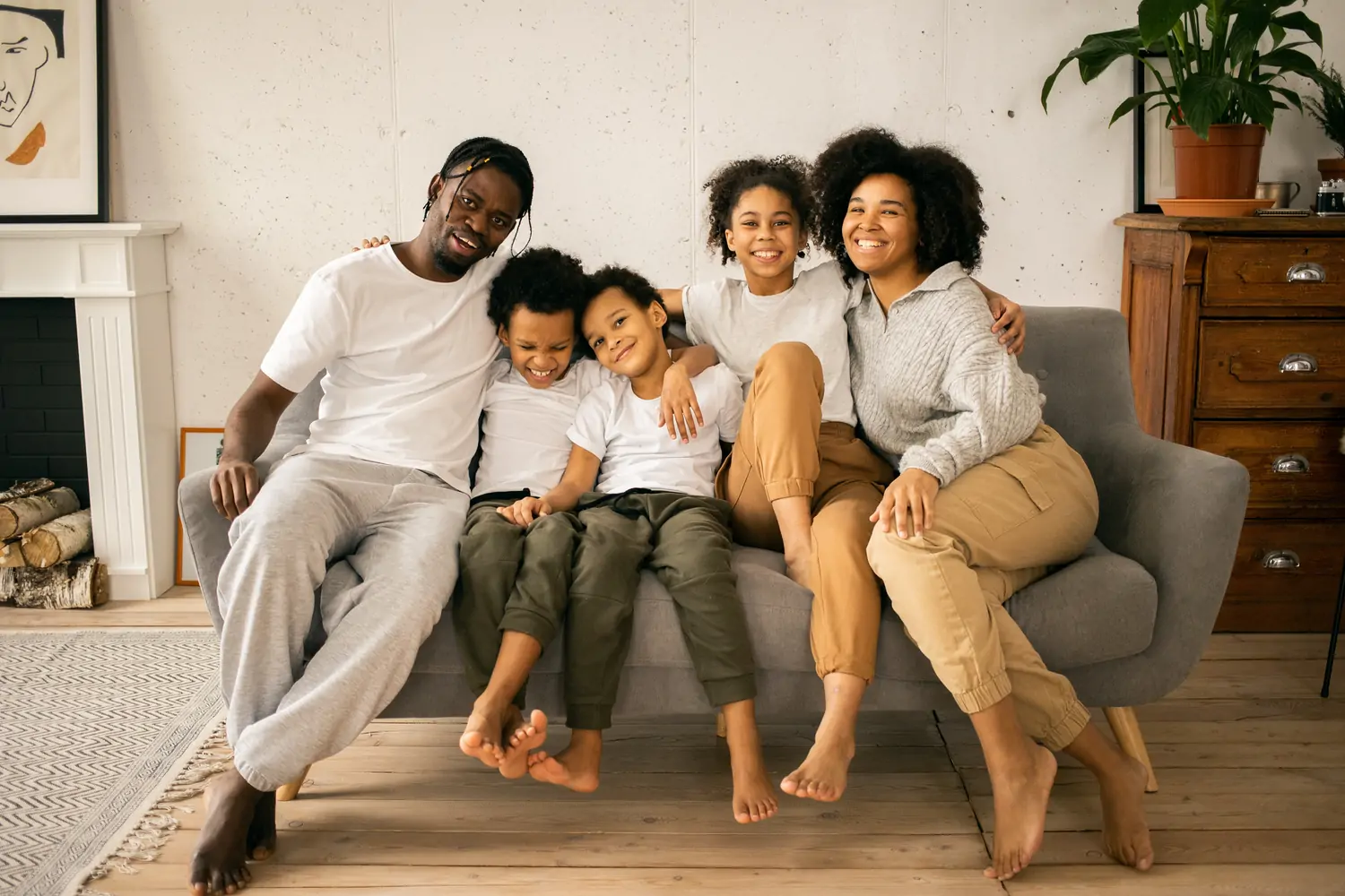 Family bunched together on a couch.